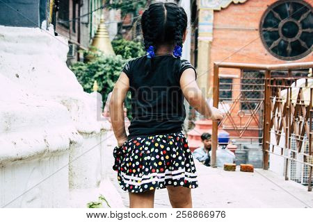 Kathmandu Nepal August 24, 2018 View Of A Nepali Child Playing Around The Shree Gha Stupa Temple Loc
