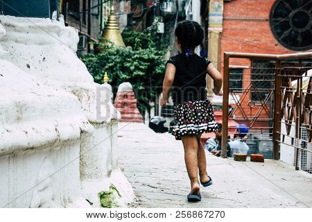 Kathmandu Nepal August 24, 2018 View Of A Nepali Child Playing Around The Shree Gha Stupa Temple Loc
