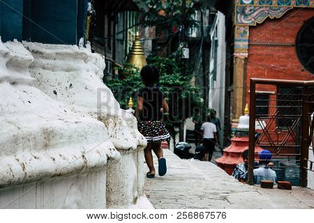 Kathmandu Nepal August 24, 2018 View Of A Nepali Child Playing Around The Shree Gha Stupa Temple Loc