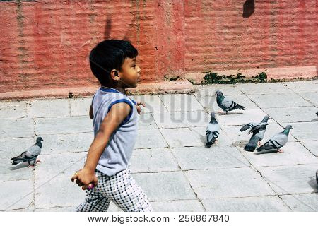 Kathmandu Nepal August 24, 2018 View Of A Nepali Child Playing Around The Shree Gha Stupa Temple Loc