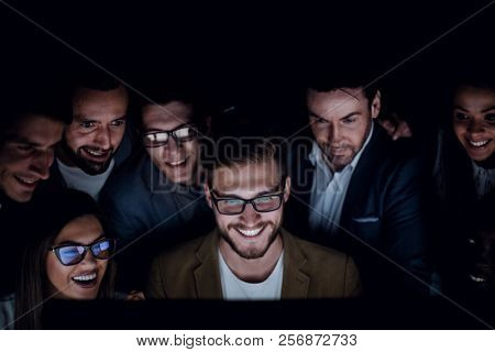 close up.a group of employees working in the office late