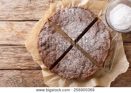 Swedish Traditional Dessert: Kladdkaka Chocolate Sticky Cake With Powdered Sugar Close-up. Horizonta