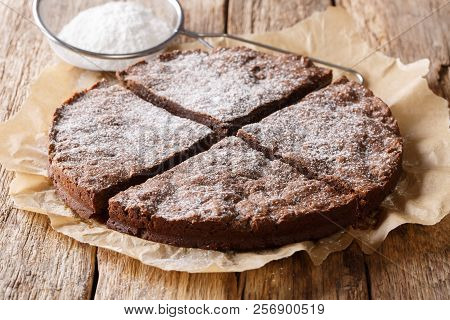 Home-made Fresh Swedish Dessert: Kladdkaka Chocolate Sticky Cake With Powdered Sugar Close-up. Horiz