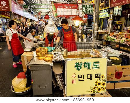 Seoul, South Korea - June 21, 2017: Sellers Of Korean Food Waiting Customers At Gwangjang Market In 