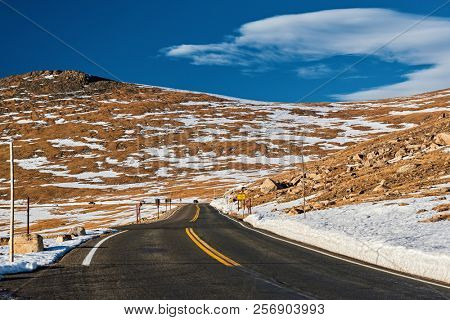 Trail Ridge Road, the highest (12,183 feet) continuous highway in the USA in high alpine tundra with rocks and mountains at autumn. Rocky Mountain National Park in Colorado, USA. 