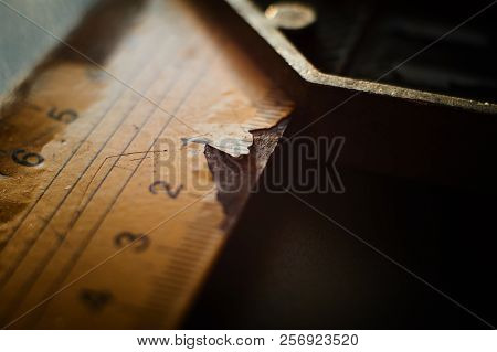Close Up View On 90 Degree Angle L Type Ruler With Metal Handle And Numbered Label Cracking While Si