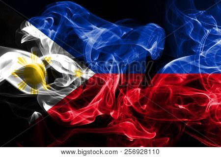 National Flag Of Philipines Made From Colored Smoke Isolated On Black Background