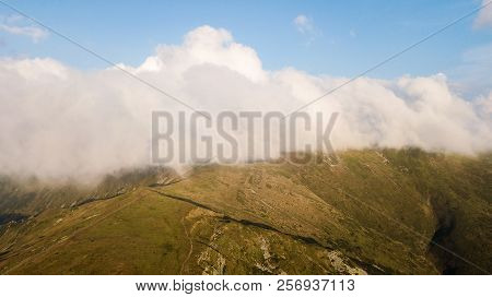 View Of The Mountains Range In Clouds From A Bird's Eye View