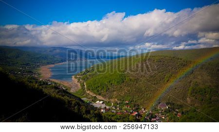 Landscape Of Mavrovo National Park With Rainbow, Mountain And Lake In Fyr Macedonia