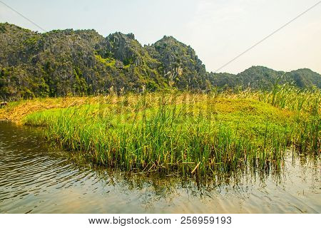 Van Long Nature Reserve With Boats And Beautiful Mountains, Ninhbinh In Vietnam