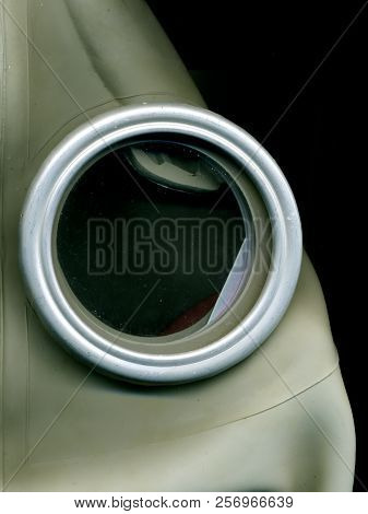 Old Soviet Green Gas Mask. The Eye Of An Old Gas Mask. Postapocalypse.