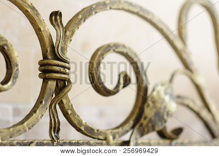 Wrought Iron Ornamental Grate For The Fireplace. Decorative Detail Of Metal Lattice For Interior.