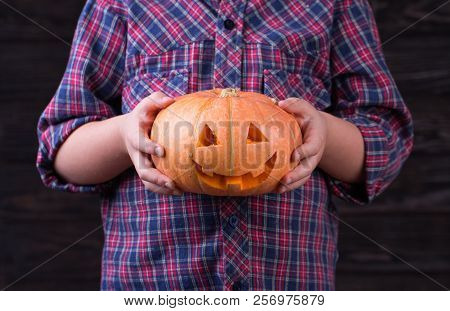 Little Girl With Carved Halloween Pumpkin Or Jack-o-lantern