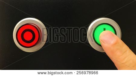 Pressing A Green Button To Startup Machine