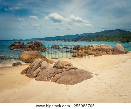 Beautiful white sand beach. Stones on a foreground. Landscape of Vietnam
