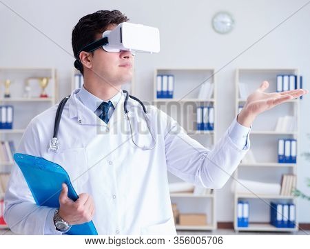 Young doctor with vr virtual reality headset working in the offi