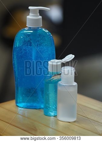 Hand Wash Gel In Plastic Bottle On Wooden Desk, Clean To Prevent Germs Protect Colona Virus, Covid 1