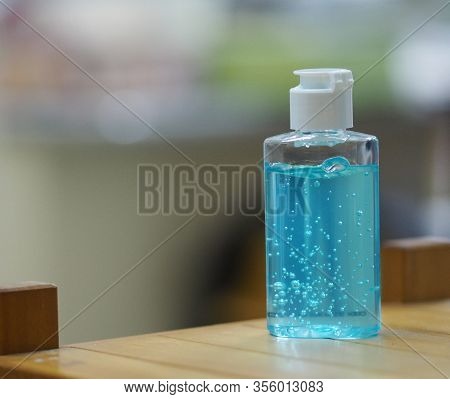 Hand Wash Gel In Plastic Bottle On Wooden Desk, Clean To Prevent Germs Protect Colona Virus, Covid 1