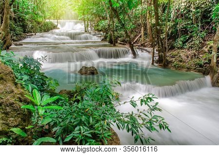 Travel To The Beautiful Waterfall In Tropical Rain Forest, Soft Water Of The Stream In The Natural P