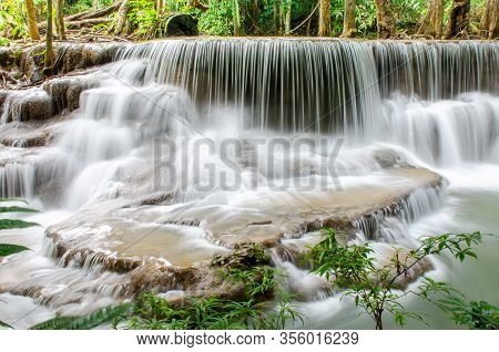 Travel To The Beautiful Waterfall In Tropical Rain Forest, Soft Water Of The Stream In The Natural P