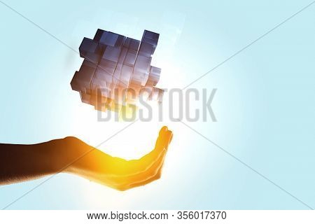 Hand holding glowing cubes. Innovation and creativity concept.