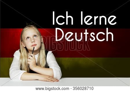 Thinking Child Girl Student Against The Germany Flag Background. Deutsch Concept With Inscription Le