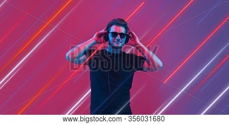 Creative Emotions And Neon Lines On Purple Background, Flyer, Proposal. Caucasian Young, Musician, P