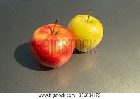 Juicy Ripe Apple Fruits On A Gray Background