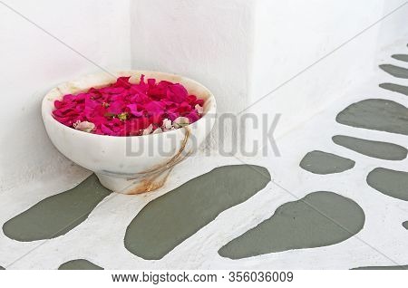 Traditional Cycladic Pavement At Koufonisia Islands Greece With Flower Pot Full Of Pink Bougainville
