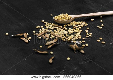Organic Food. Soy Diet. Soybean Seeds On The Kitchen Table