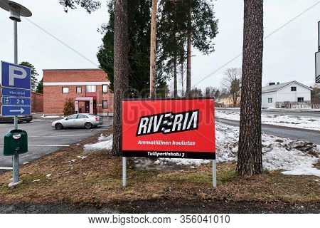 Joensuu, Finland - March 13, 2020: Road Sign Riveria - Professional School On The Background Buildin