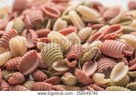 Gnocchetti Multicolored Pasta Background Concept. Diet And Healthy Food Concept