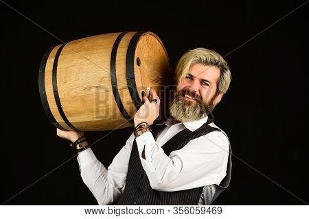 Degustator Man. Sommelier Tastes Expensive Drink. Elegant Waiter Carry Wine. Working In Wine Cellar.