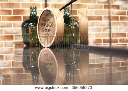 The Wall Is Green. On The Countertop Is A Tray And A Green Bottle.