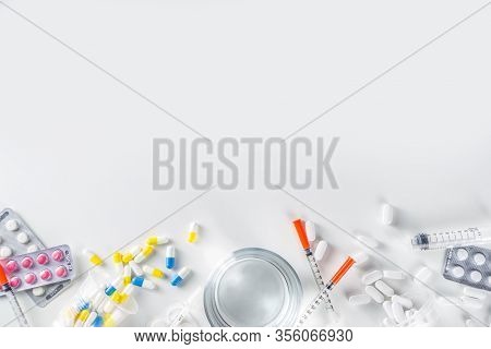 Pharmaceutical Medicine Pills Concept, Assorted Various Pills, Tablets And Capsules With Medical Syr