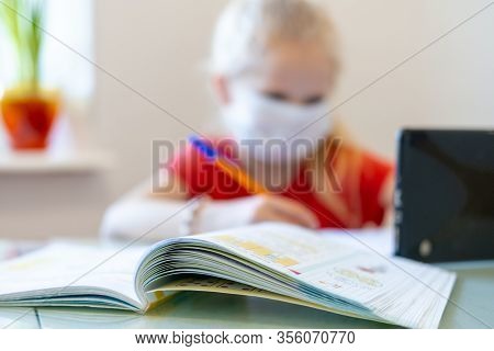 Distance Learning Online Education. Blurred Sickness Schoolgirl In Medical Mask Studying At Home Wit