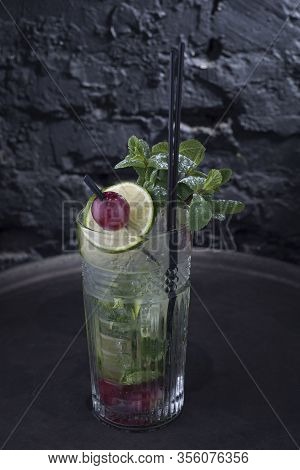 Close-up, Advertising Shot Of A Light Alcoholic Cocktail, With A Sprig Of Mint, Icing Sugar, With De