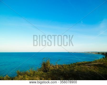 Baltic Sea From Cliff In Mechelinki, Poland. Nature And Travel Concept. Copy Space On Blue Sky.