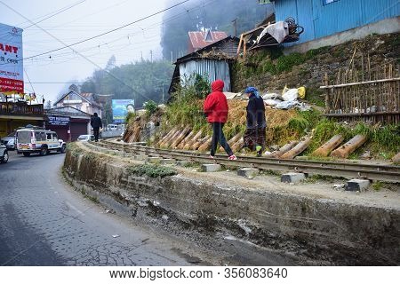 Ghoom, India- December 27, 2019:man And Woman Walking On A Foggy Morning At Autumn And Winter Season
