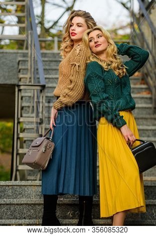 Confident In Style. Girls In Corrugated Skirt And Sweater. Female Beauty. Knitwear Fashion. Charm. S