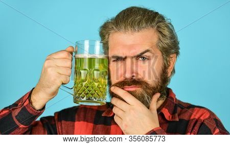 Serious Homebrewer. Recreation. Man Hold Glass Of Beer. Hipster At Bar Counter. Having Fun Watching 