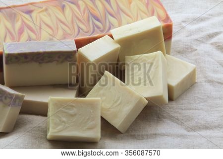 Display Of A Variety Of Soaps On Linen Background