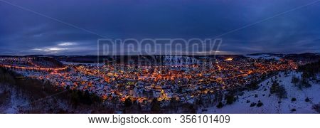 Snowy Cityscape Of The Town Albstadt In Baden Wuerttemberg, Germany At The Late Evening Hour With Gl