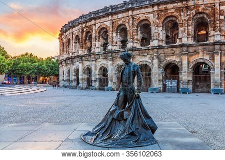 Nimes, France - July  2, 2018: Ancient Roman Amphitheatre In The Occitanie Region Of Southern France