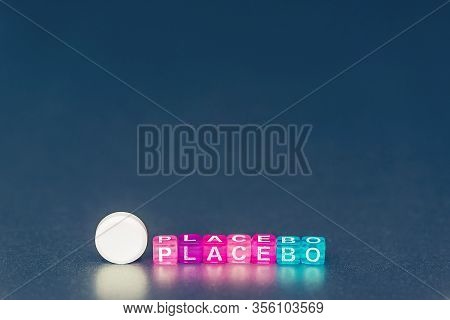 Placebo Pill. White Pills And Word Placebo On Silver Grey Background. Placebo Effect, Fake Medical T