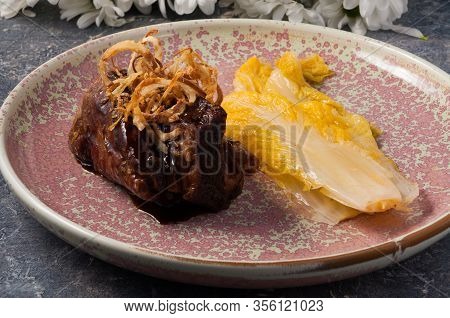 Beef Cheek With Lettuce And Fried Onions. Horizontal Frame