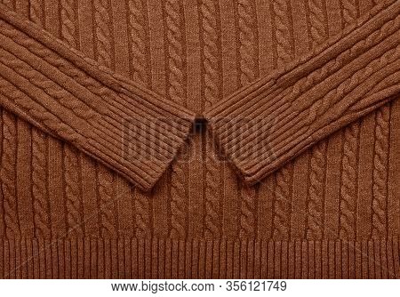 Close Up Background Texture Of Brown Cable Knitted Wool Jersey Fabric Sweater With Row Braid Pattern