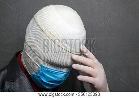 Incognito Man In A Medical Mask Is Dressed In A Business Suit
