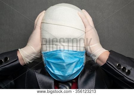 Incognito Man In A Medical Mask Is Dressed In A Business Suit