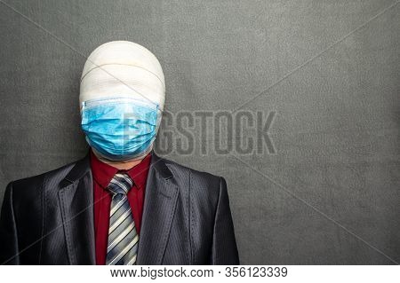 Incognito Man In A Medical Mask Is Dressed In A Business Suit